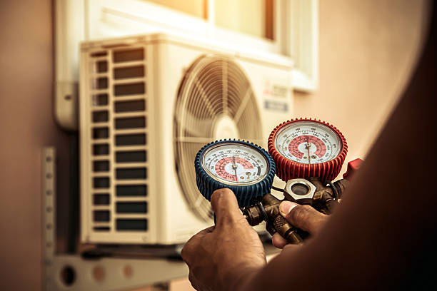 Professional Air Conditioning Service technician working in Mill City, OR